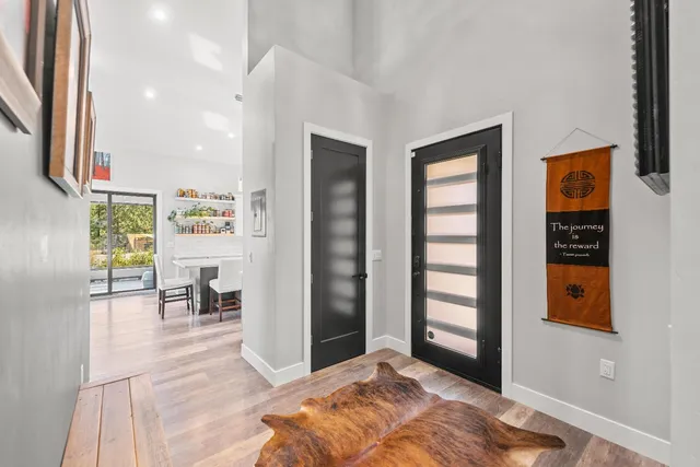 a kitchen with stainless steel appliances granite countertop a sink and a stove