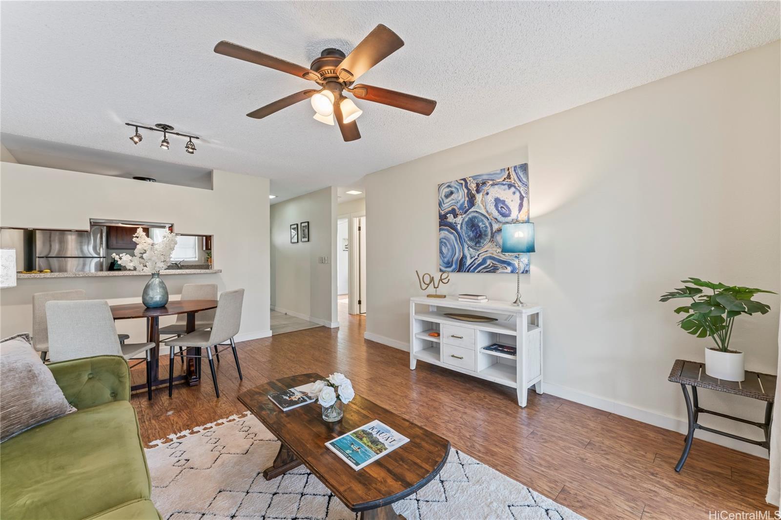 92-1136 Hame Street, Unit 10102 Kapolei, HI 96707 - Photo 2 of 22 a living room with furniture and wooden floor