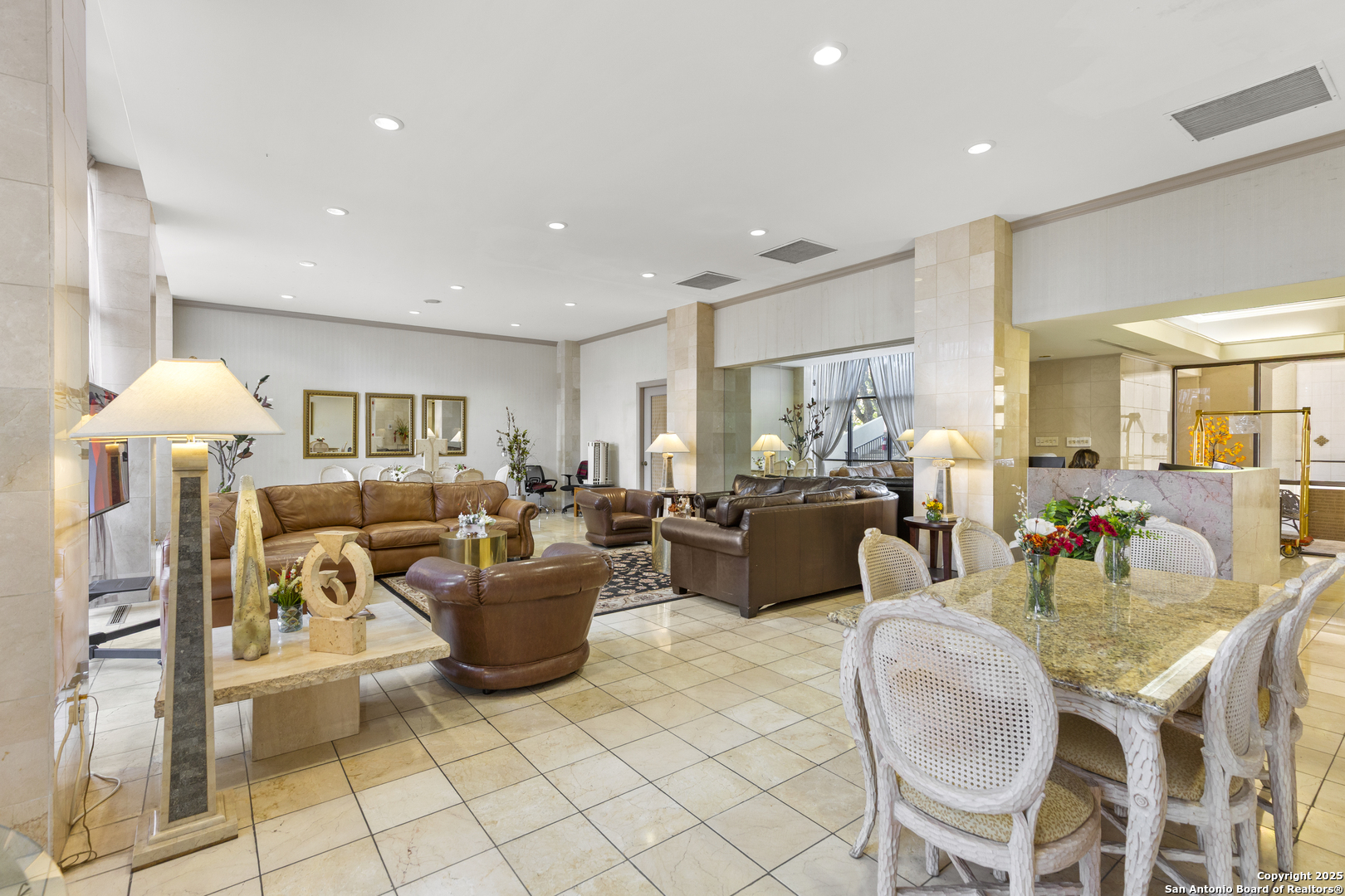 7701 Wurzbach Road, Unit 1701 San Antonio, TX 78229 - Photo 30 of 41 a living room with furniture and a table
