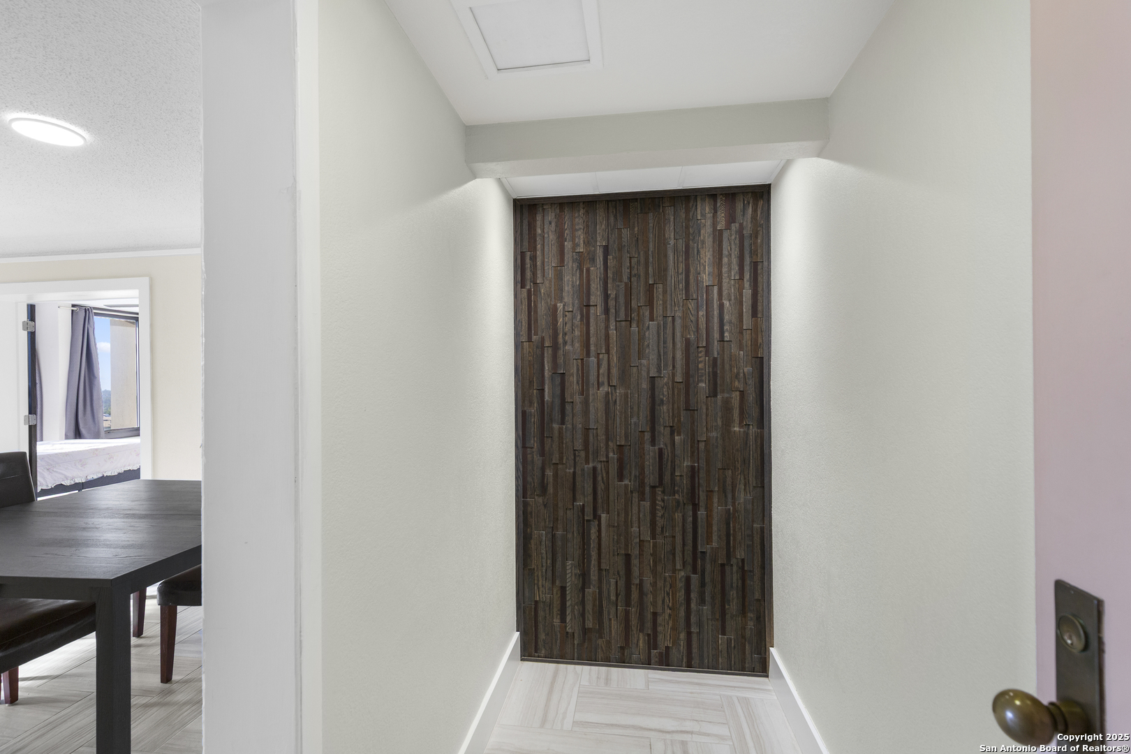 7701 Wurzbach Road, Unit 1701 San Antonio, TX 78229 - Photo 5 of 41 a view of kitchen with furniture and wooden floor