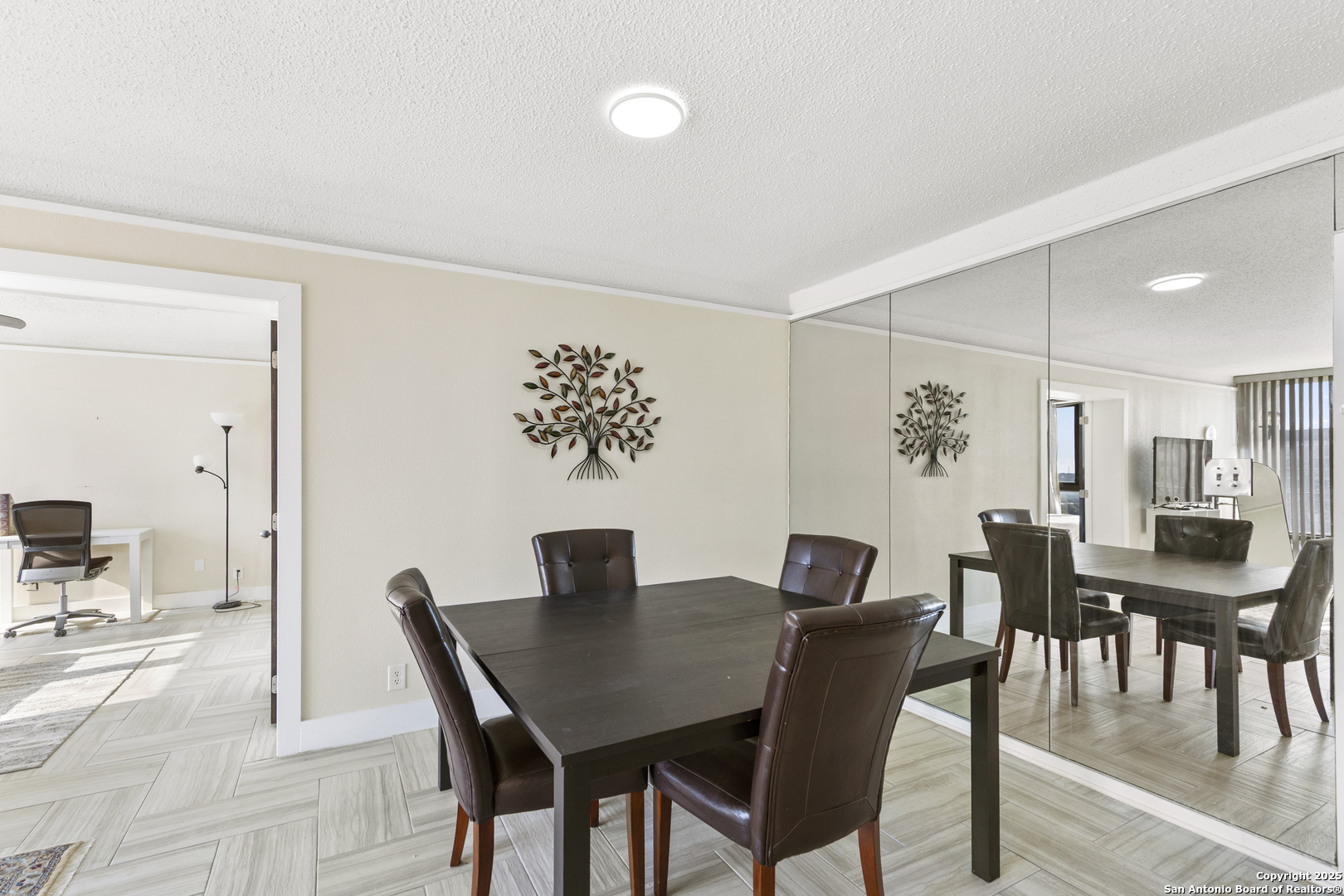 7701 Wurzbach Road, Unit 1701 San Antonio, TX 78229 - Photo 7 of 41 a view of a dining room with furniture
