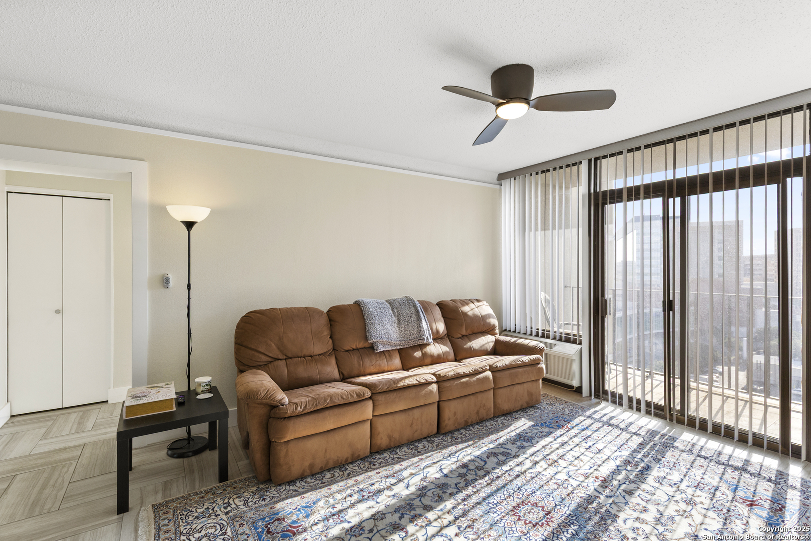 7701 Wurzbach Road, Unit 1701 San Antonio, TX 78229 - Photo 9 of 41 a living room with furniture and a large window