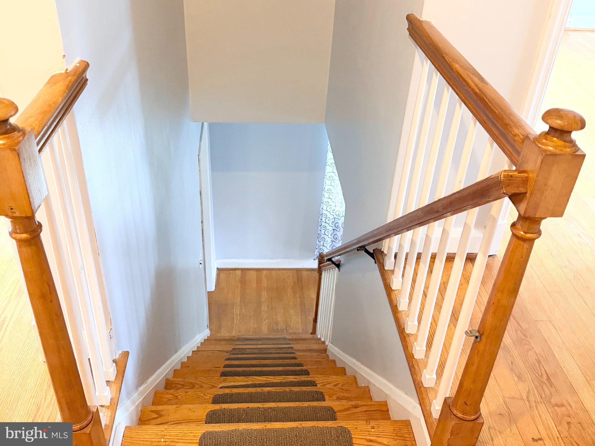 1615 Burnwood Road Baltimore, MD 21239 - Photo 19 of 83 Inviting staircase to upper retreat.