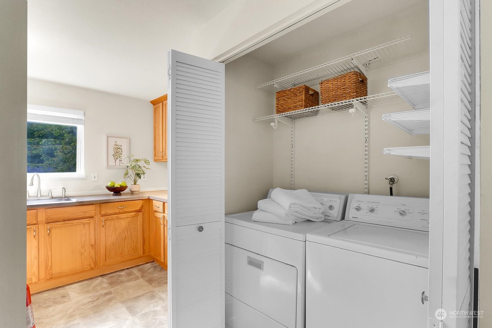 10822 East Riverside Drive, Unit A203 Bothell, WA 98011 - Photo 8 of 20 a bedroom with a bed and a cabinets