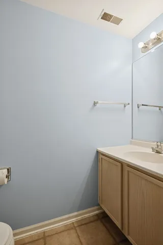 a bathroom with a sink and vanity