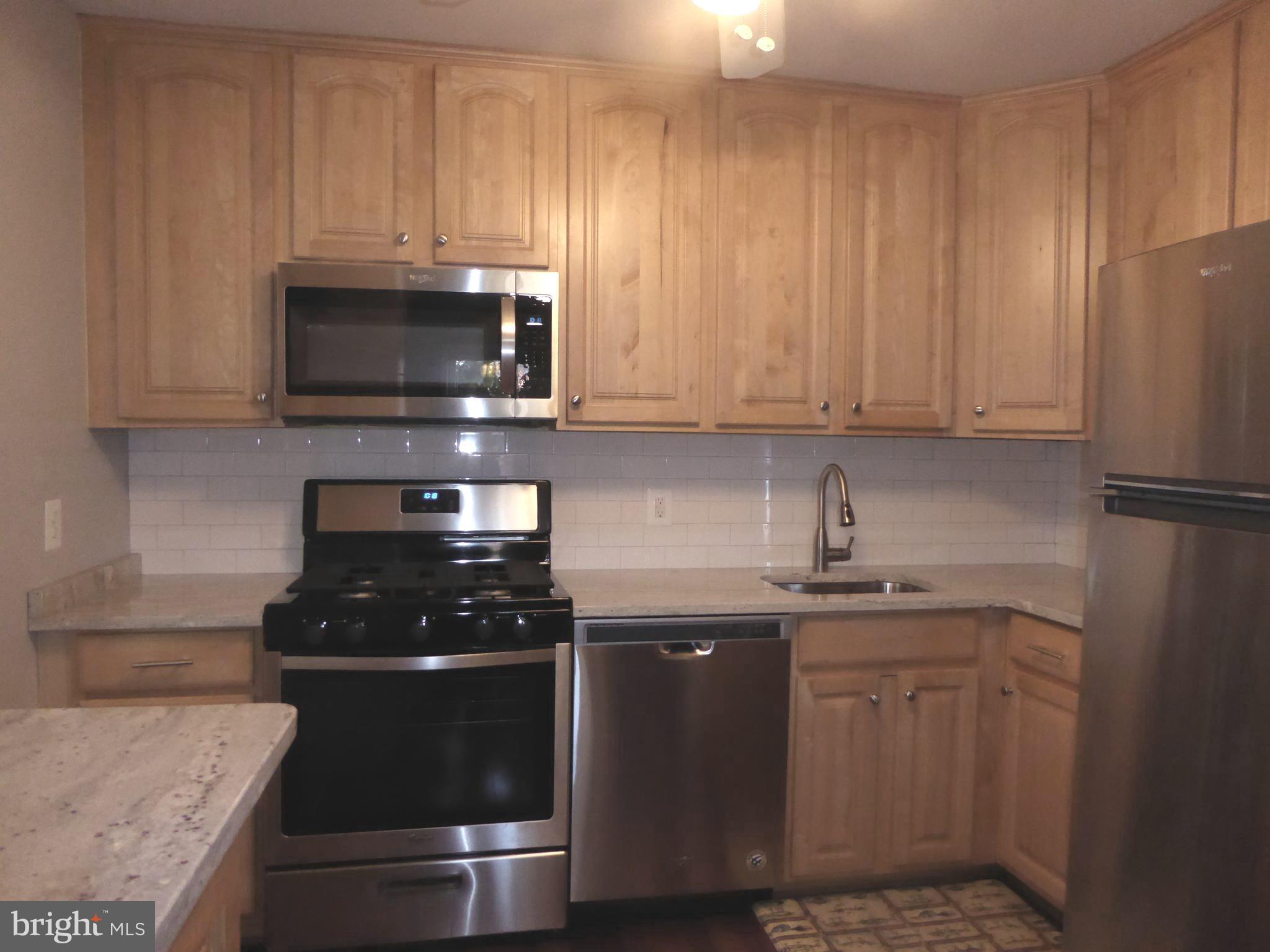 5572 Kendrick Lane Burke, VA 22015 - Photo 24 of 57 Upgraded granite counter and tile splash back