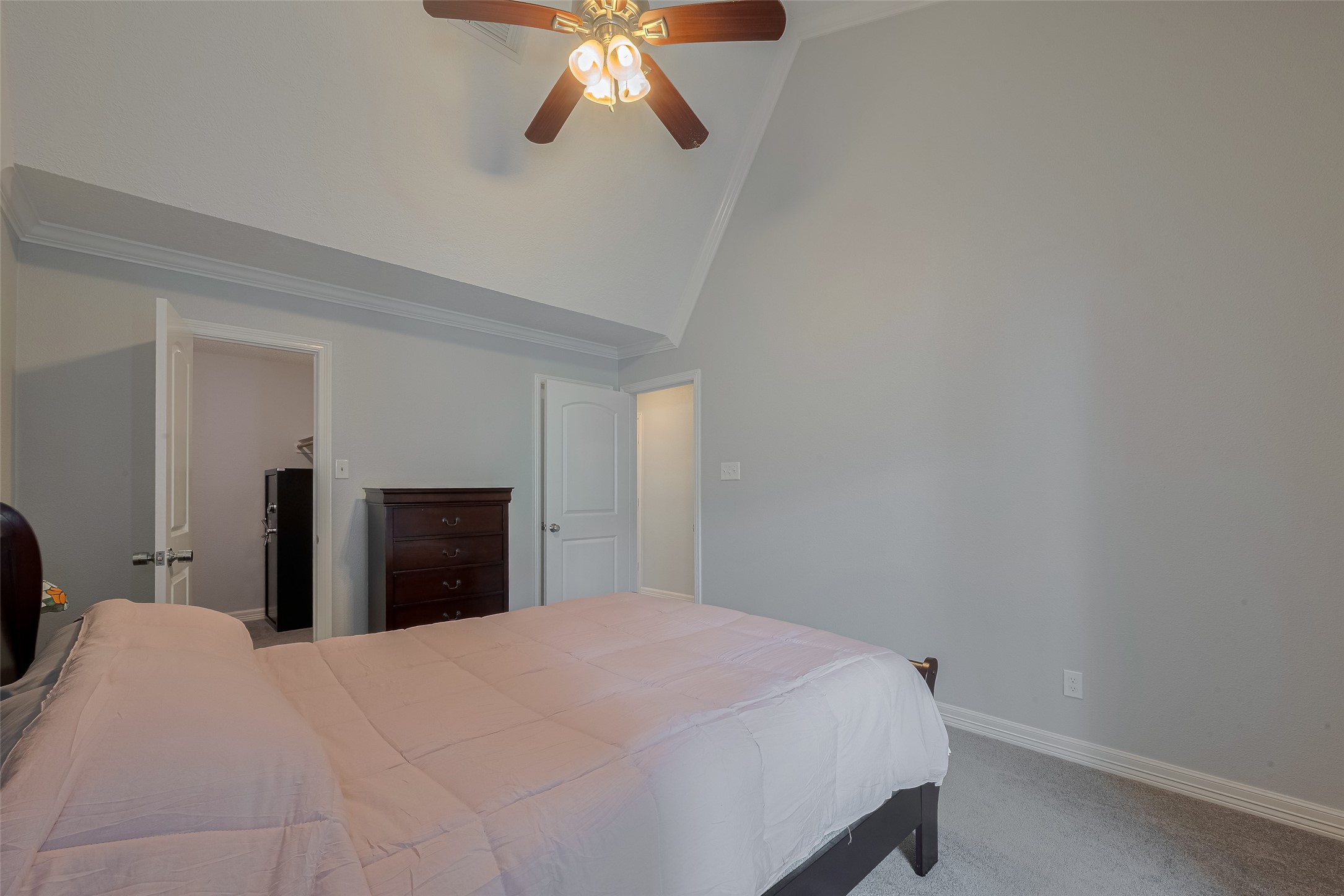 64 Hideaway Drive Friendswood, TX 77546 - Photo 17 of 33 a bedroom with a bed and a chandelier