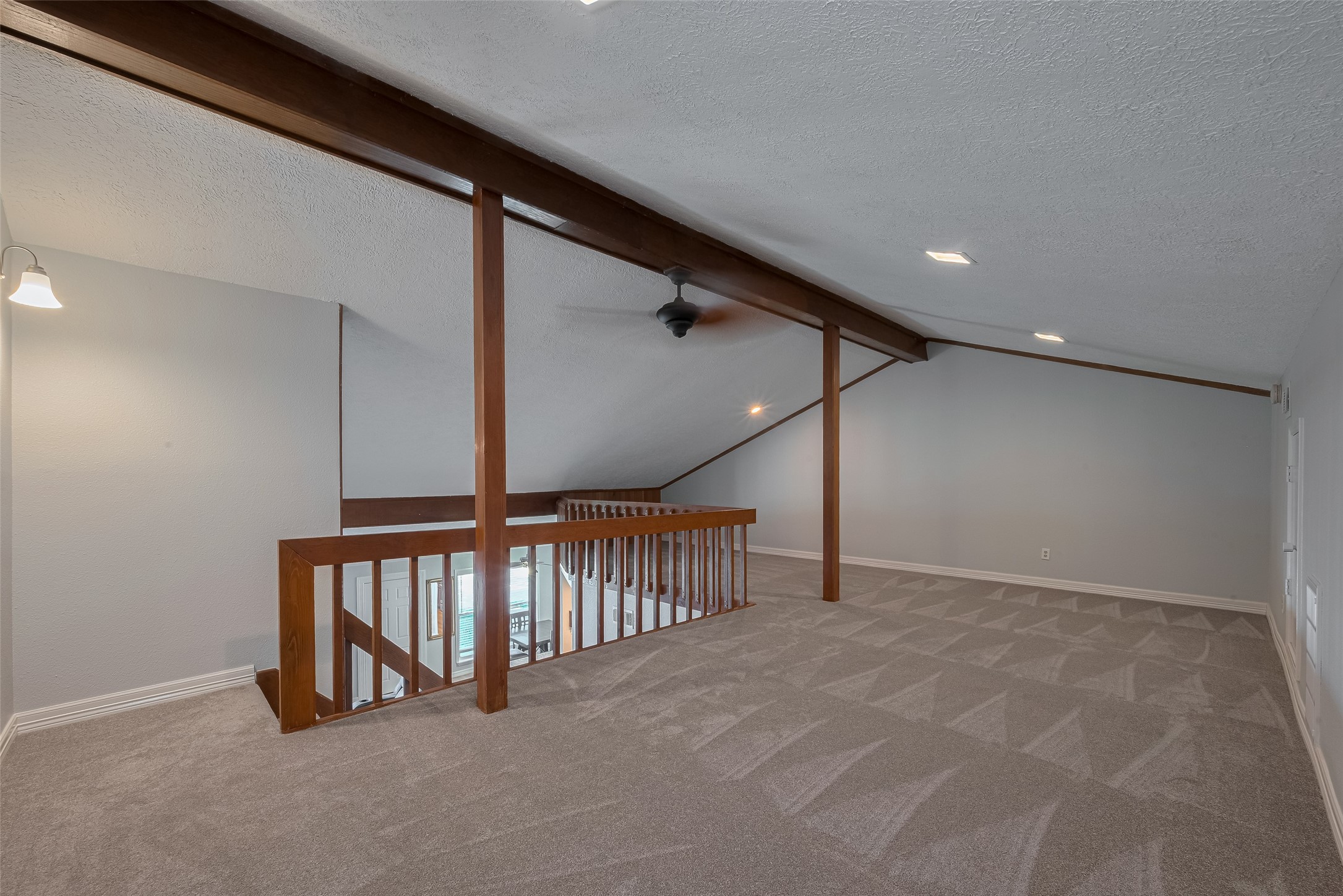 64 Hideaway Drive Friendswood, TX 77546 - Photo 19 of 33 a view of an empty room with stairs