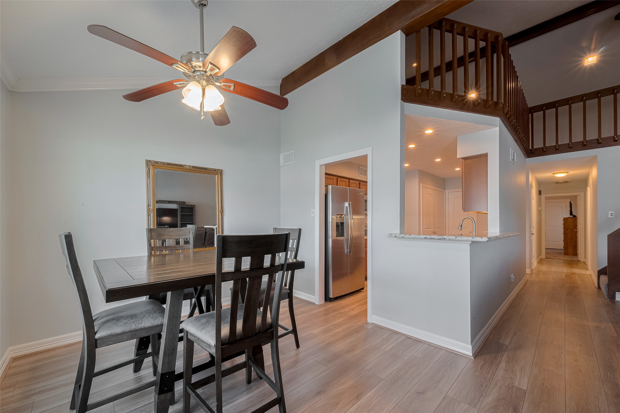 64 Hideaway Drive Friendswood, TX 77546 - Photo 7 of 33 a view of a dining room with furniture and wooden floor