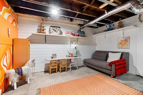 a view of a storage room with a table and chairs