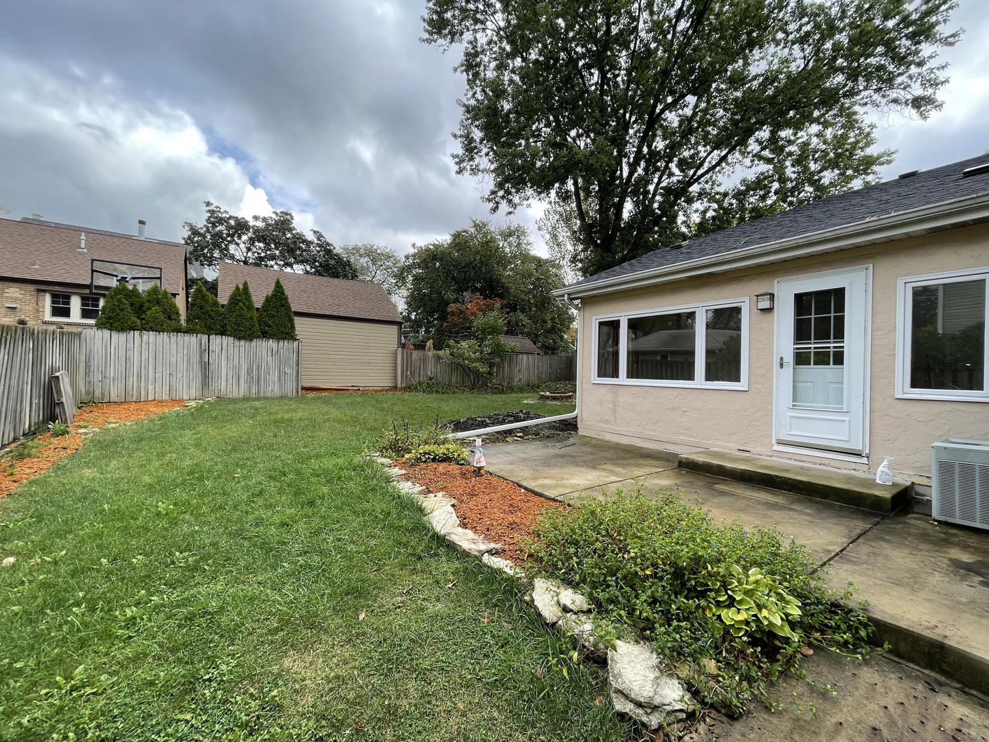 409 South Naperville Road Wheaton, IL 60187 - Photo 2 of 11 a view of a backyard with a garden