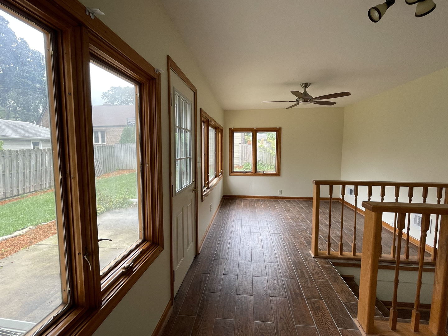 409 South Naperville Road Wheaton, IL 60187 - Photo 6 of 11 a view of hallway with wooden floor and windows