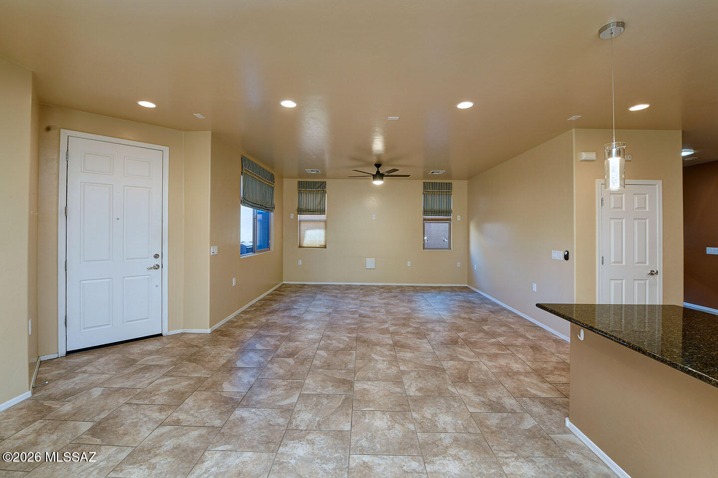13991 East Cheavront Loop Vail, AZ 85641 - Photo 12 of 47 a view of a big room with windows