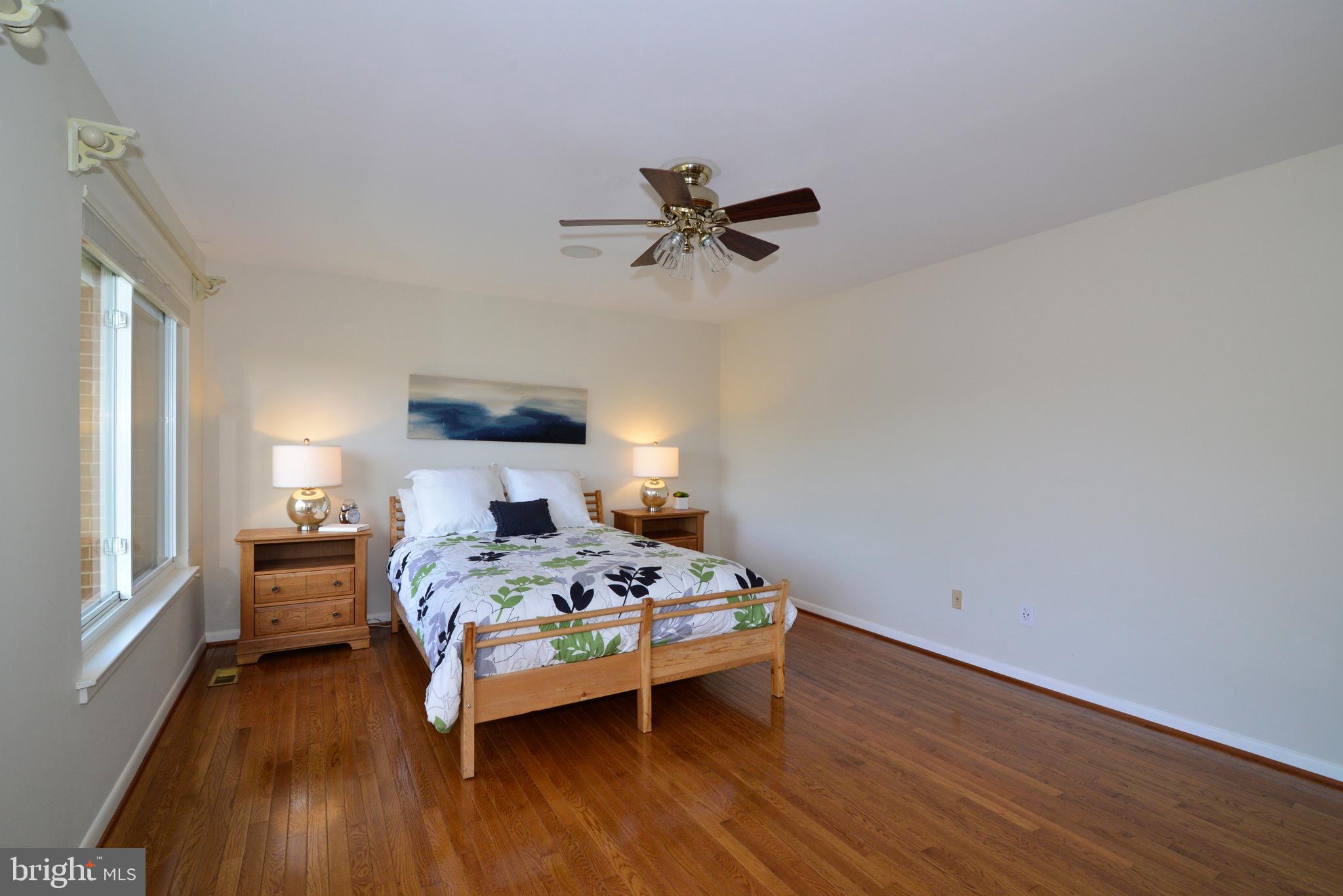 11086 Glade Court Reston, VA 20191 - Photo 23 of 44 Owner's suite with hardwoods and ceiling fan.