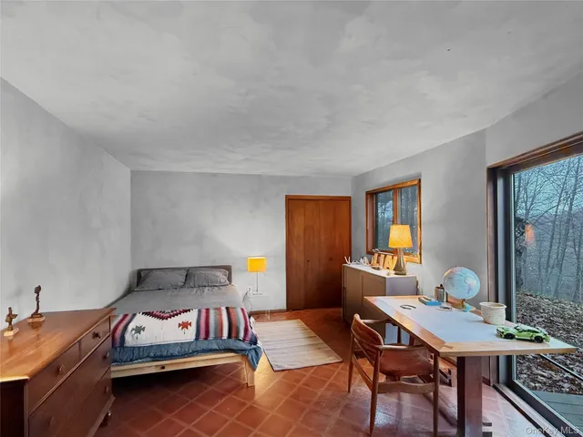 a reading room with furniture and a book shelf