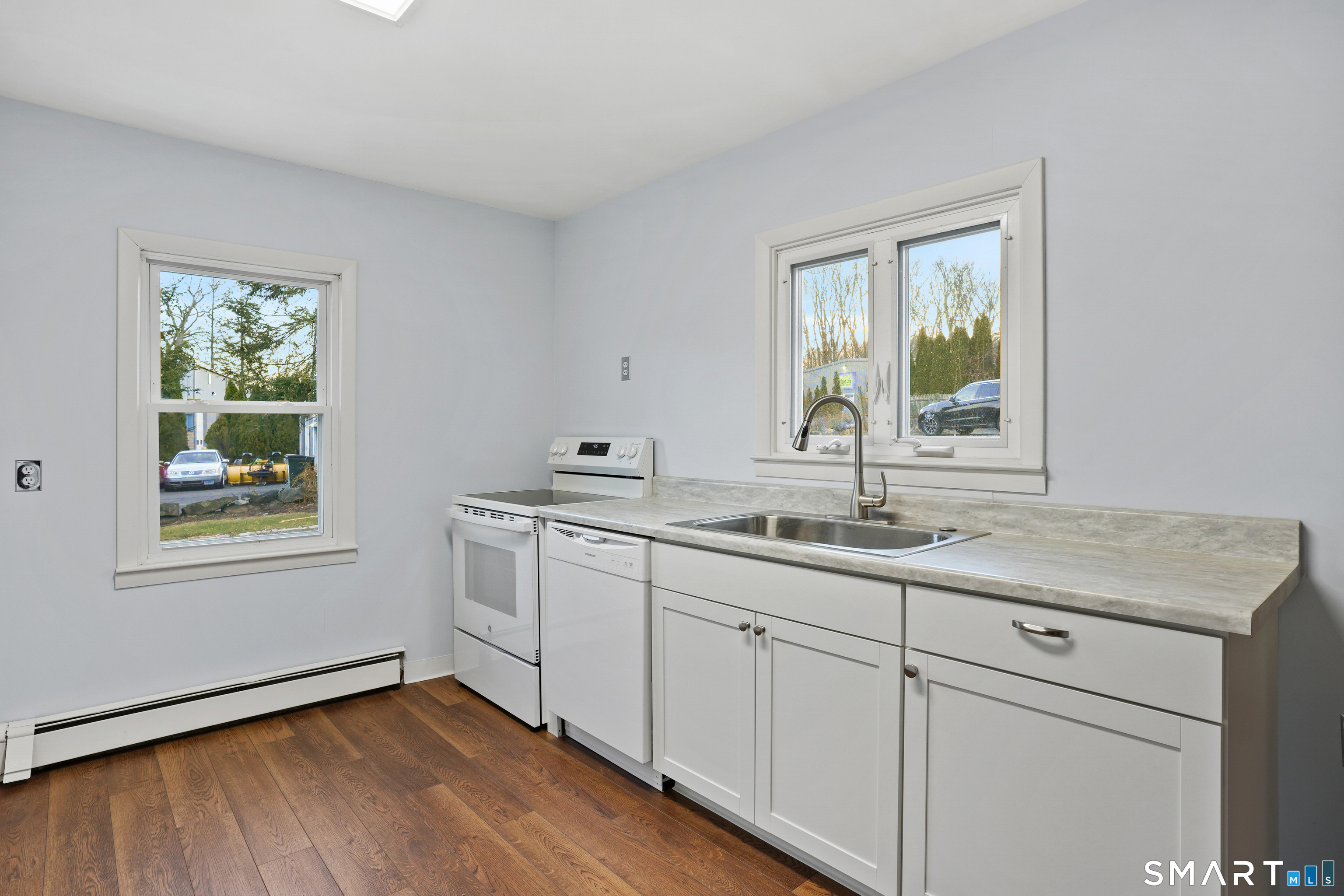 56 Beaver Brook Road Danbury, CT 06810 - Photo 11 of 38 a kitchen with a sink cabinets and window