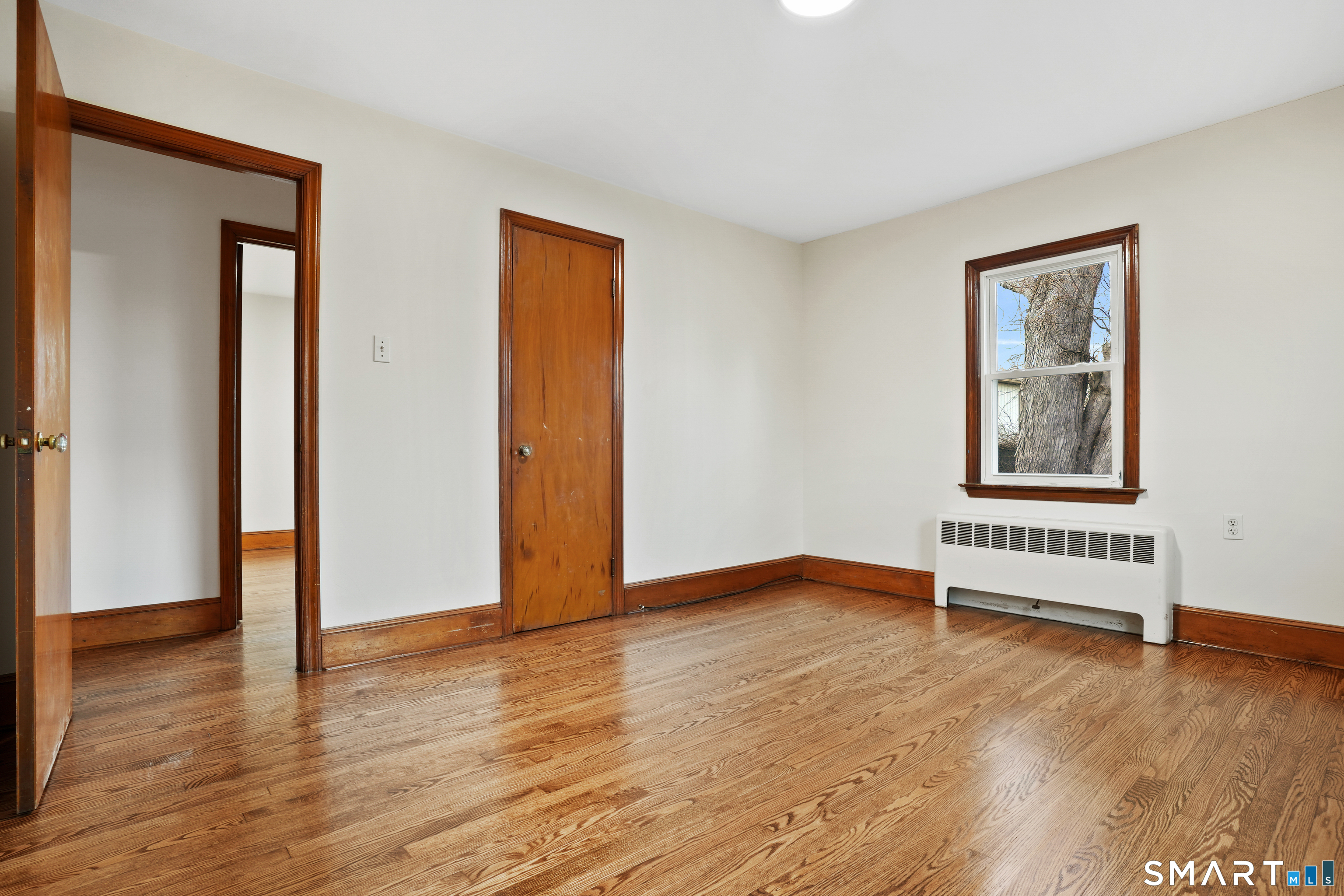 56 Beaver Brook Road Danbury, CT 06810 - Photo 13 of 38 a view of an empty room with wooden floor and windows