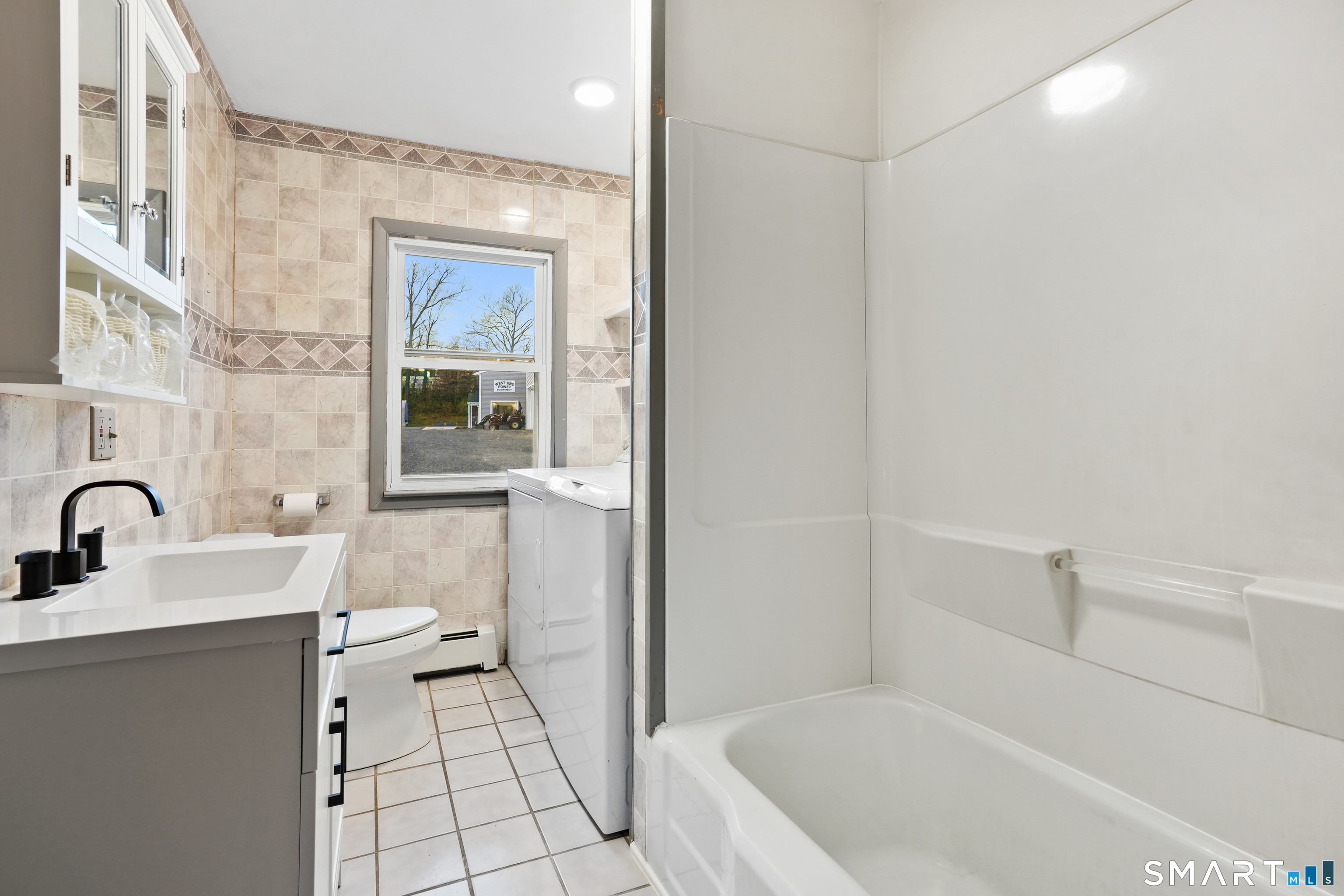 56 Beaver Brook Road Danbury, CT 06810 - Photo 17 of 38 a bathroom with a sink a toilet and shower