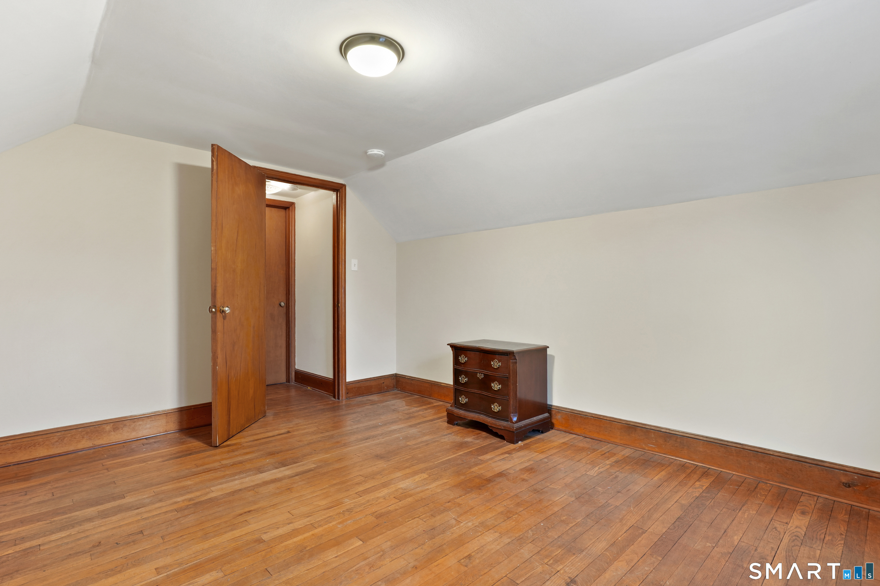 56 Beaver Brook Road Danbury, CT 06810 - Photo 24 of 38 a view of empty room with wooden floor