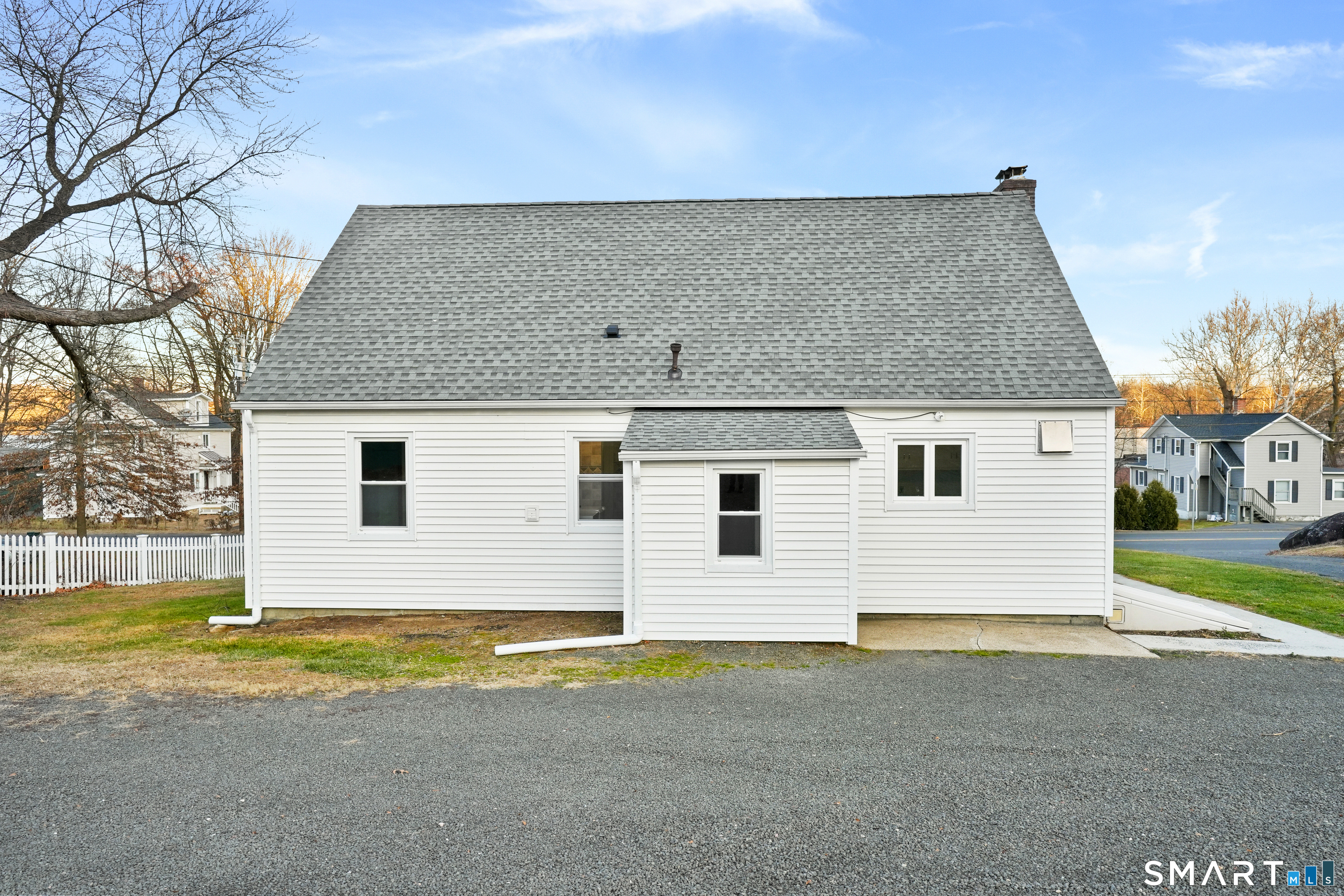 56 Beaver Brook Road Danbury, CT 06810 - Photo 27 of 38 a view of a house with backyard and trees in the background