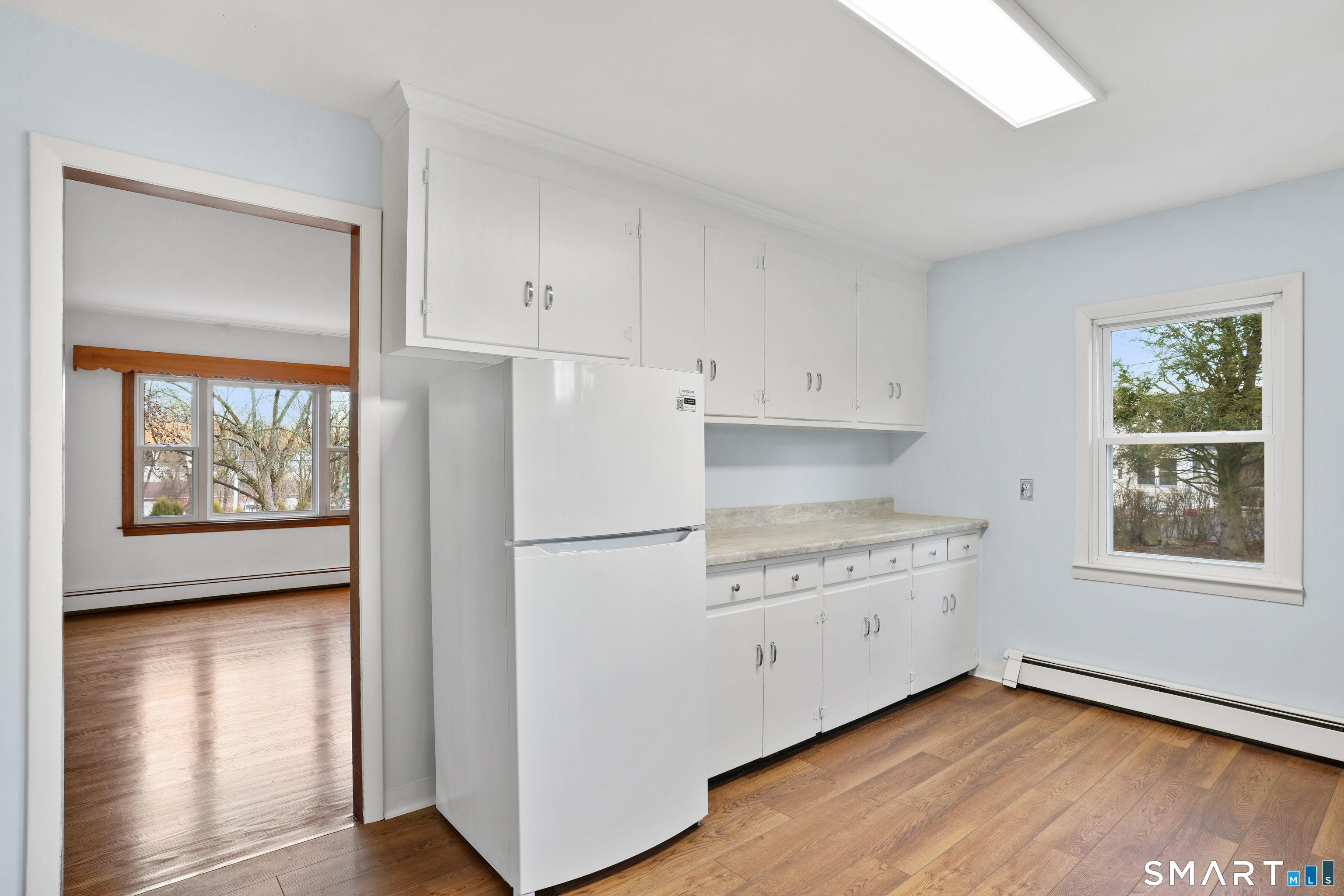 56 Beaver Brook Road Danbury, CT 06810 - Photo 5 of 38 a kitchen with appliances cabinets and a large window