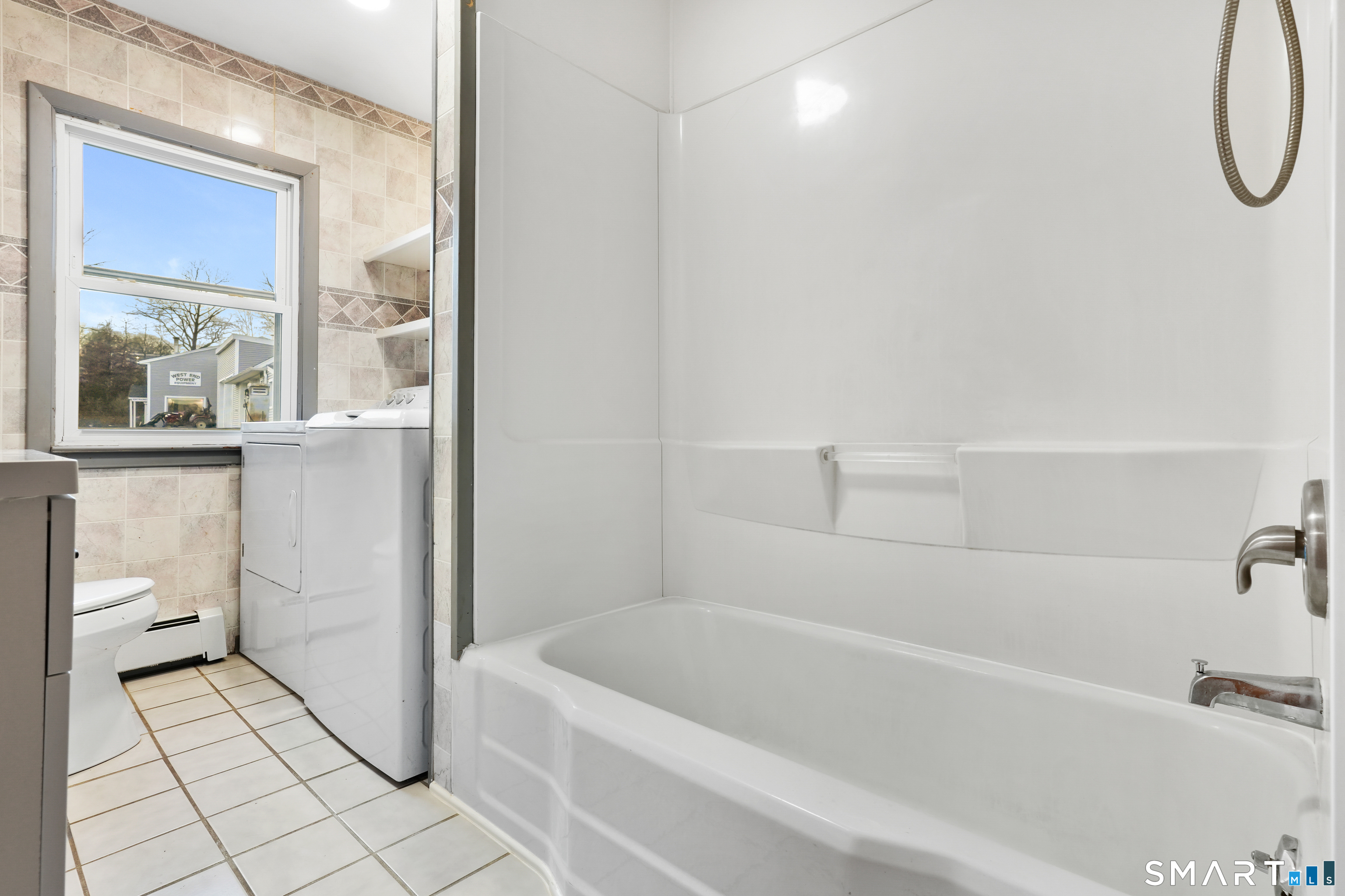 56 Beaver Brook Road Danbury, CT 06810 - Photo 8 of 38 a bathroom with a tub a toilet and a shower