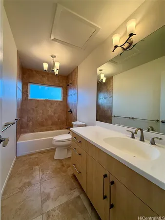 a spacious bathroom with a double vanity sink toilet mirror and bathtub