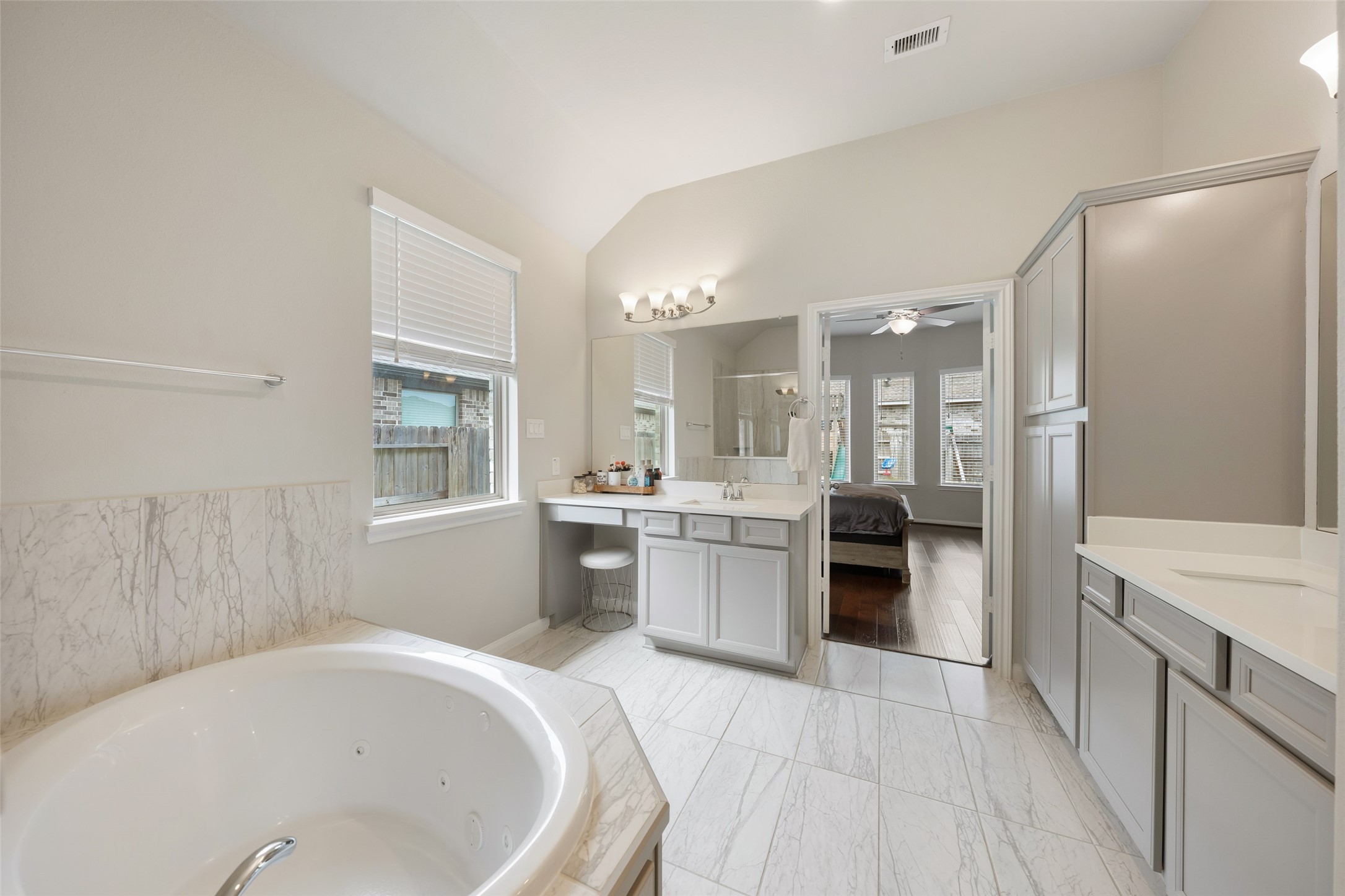 17323 Grand Canyon Road Conroe, TX 77302 - Photo 17 of 33 Double vanities with basins and a generous linen cupboard.