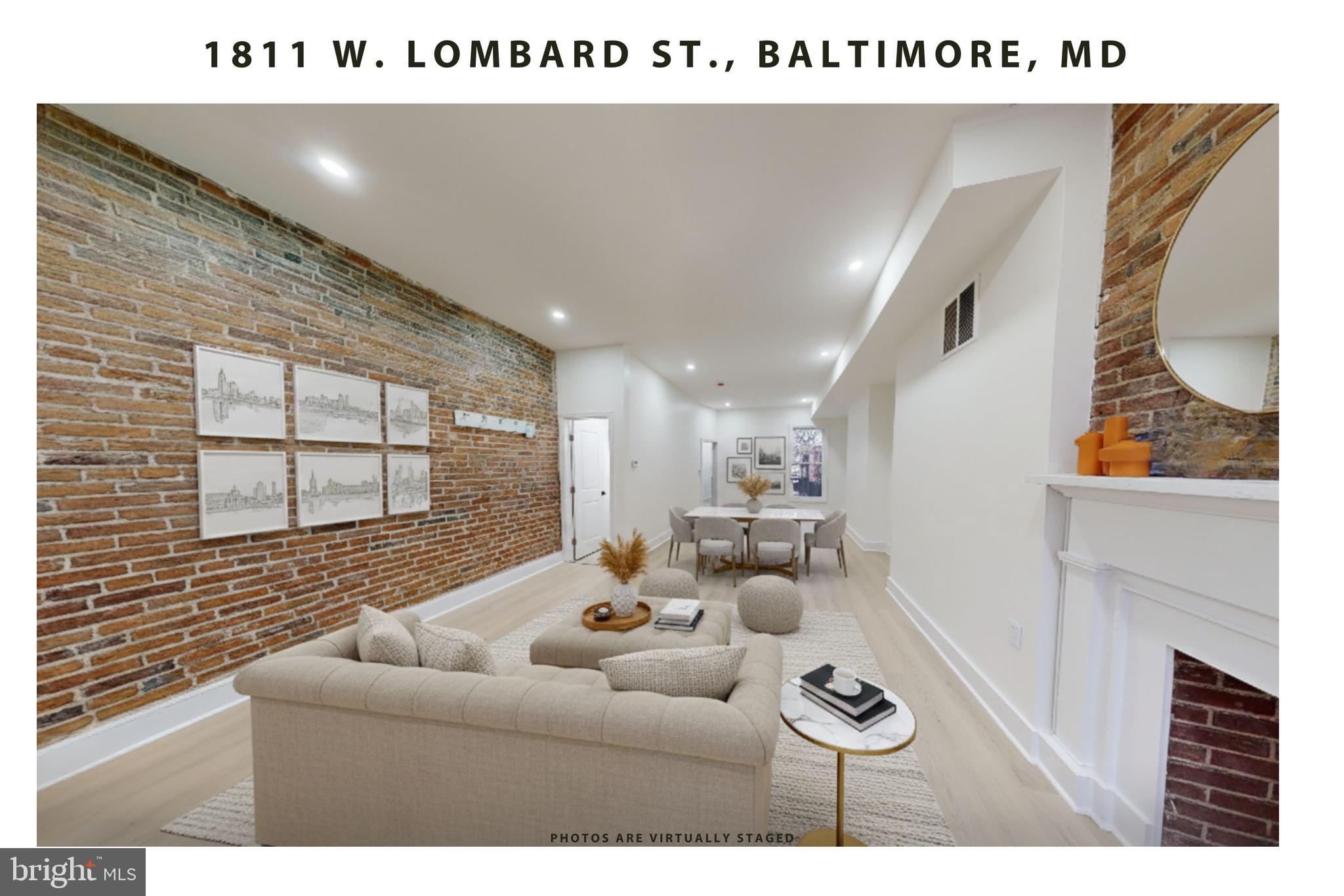 1811 West Lombard Street Baltimore, MD 21223 - Photo 2 of 19 a living room with furniture and a large window