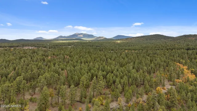 a view of mountain with lake view