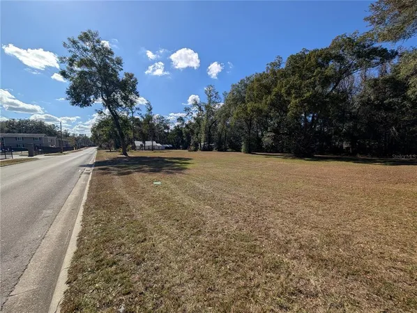 a view of a lake with a yard