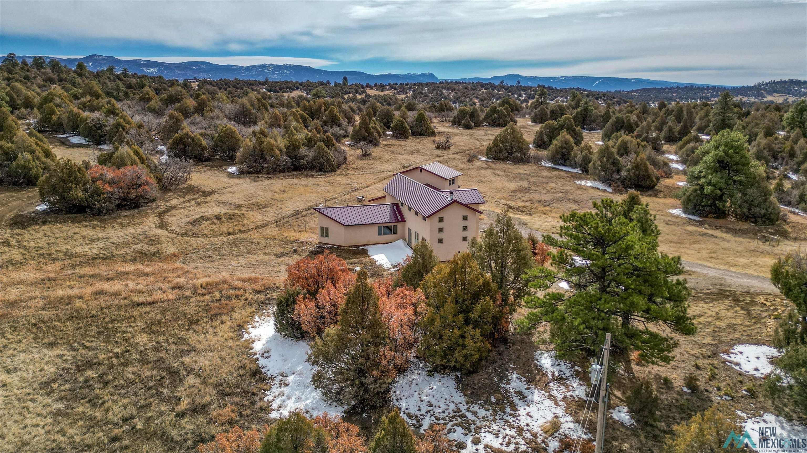 12 Horn Toad Road Chama, NM 87520 - Photo 2 of 52 Aerial view of property and surrounding area with mountains