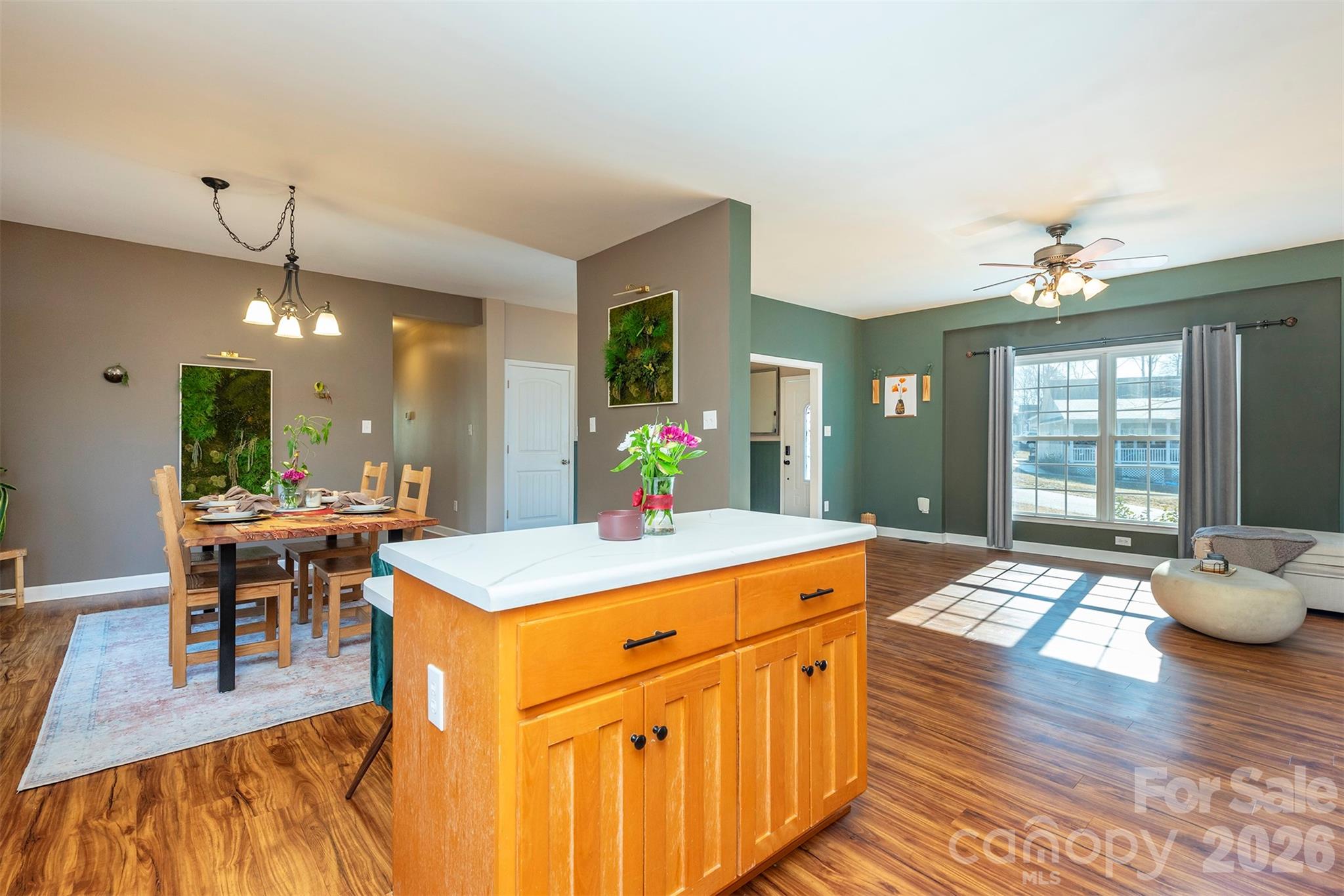 243 Scenic Ridge Drive Hendersonville, NC 28792 - Photo 12 of 47 a room with stainless steel appliances kitchen island a table and chairs in it