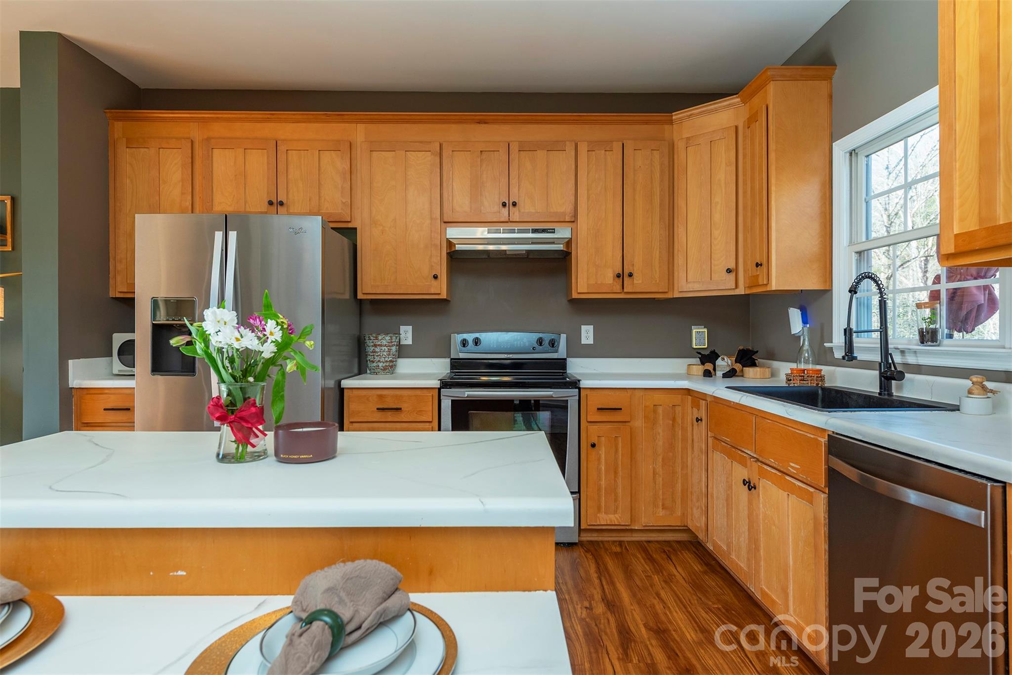 243 Scenic Ridge Drive Hendersonville, NC 28792 - Photo 14 of 47 a kitchen with stainless steel appliances granite countertop a refrigerator and sink