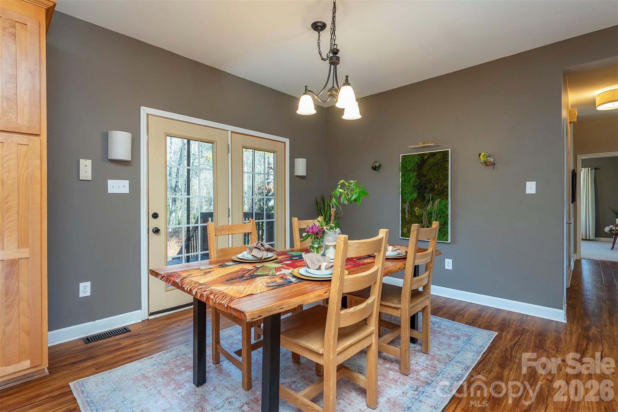 243 Scenic Ridge Drive Hendersonville, NC 28792 - Photo 15 of 47 a view of a dining room with furniture window and wooden floor