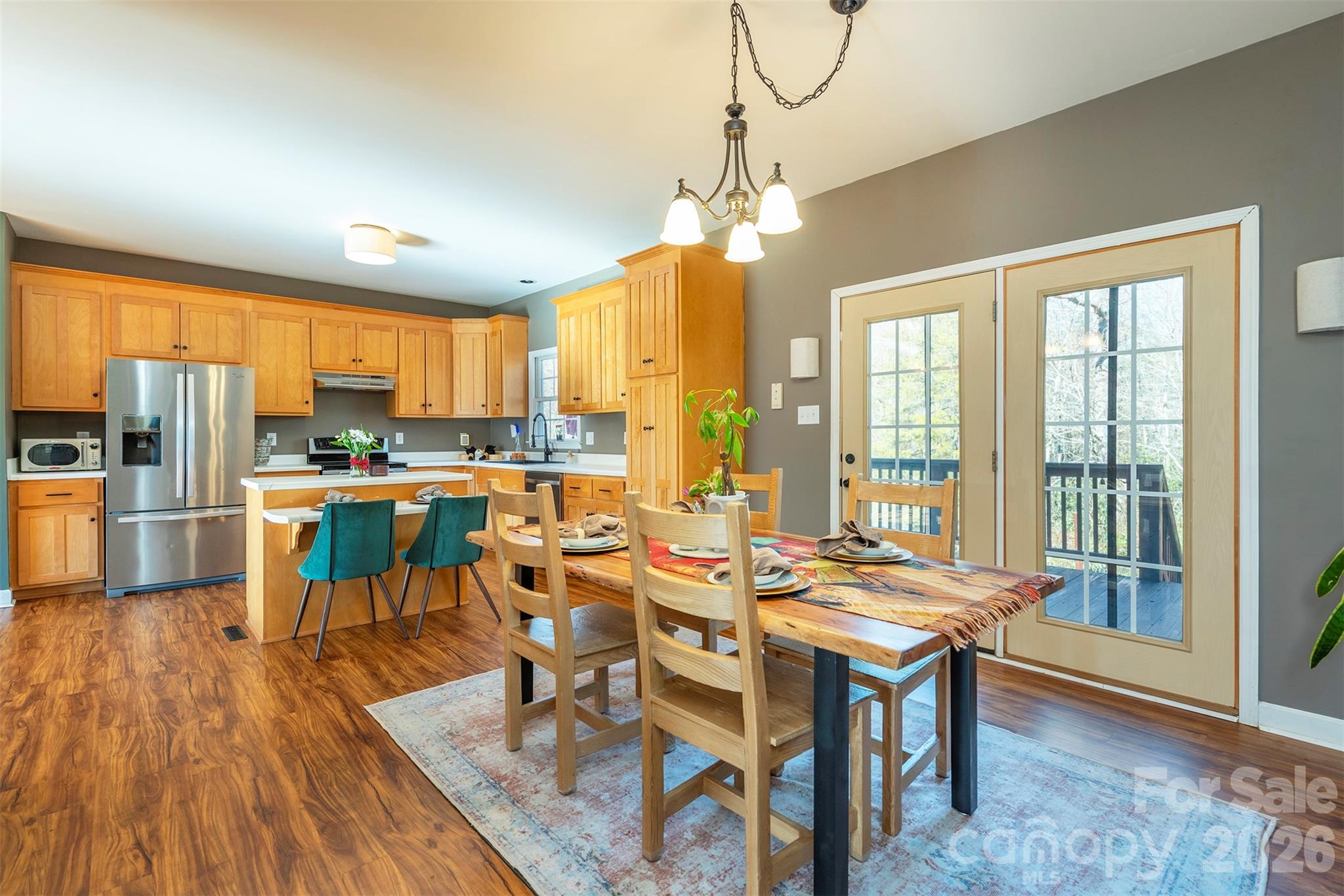 243 Scenic Ridge Drive Hendersonville, NC 28792 - Photo 16 of 47 a large kitchen with a table and chairs