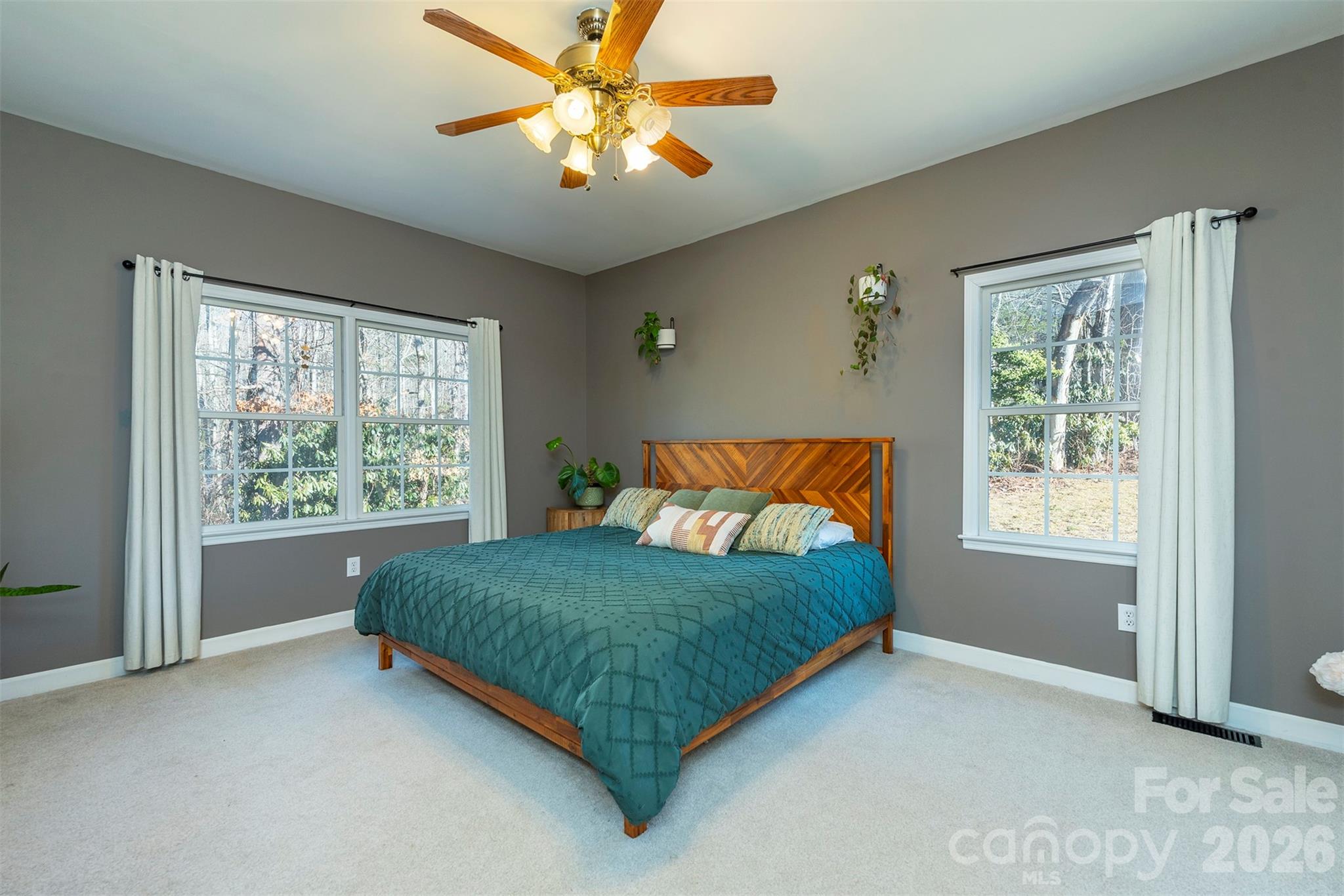 243 Scenic Ridge Drive Hendersonville, NC 28792 - Photo 18 of 47 a bed sitting in a bedroom next to a window
