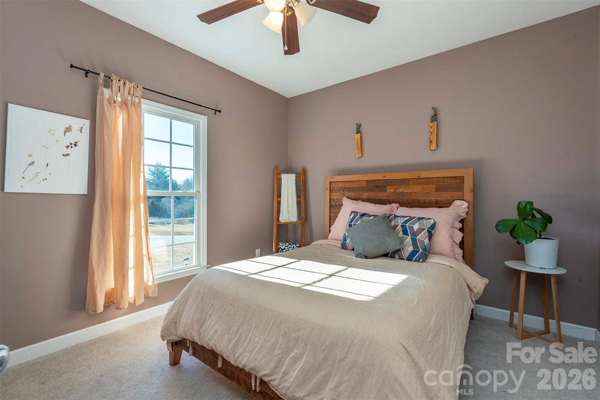 243 Scenic Ridge Drive Hendersonville, NC 28792 - Photo 24 of 47 a bedroom with a bed and a window