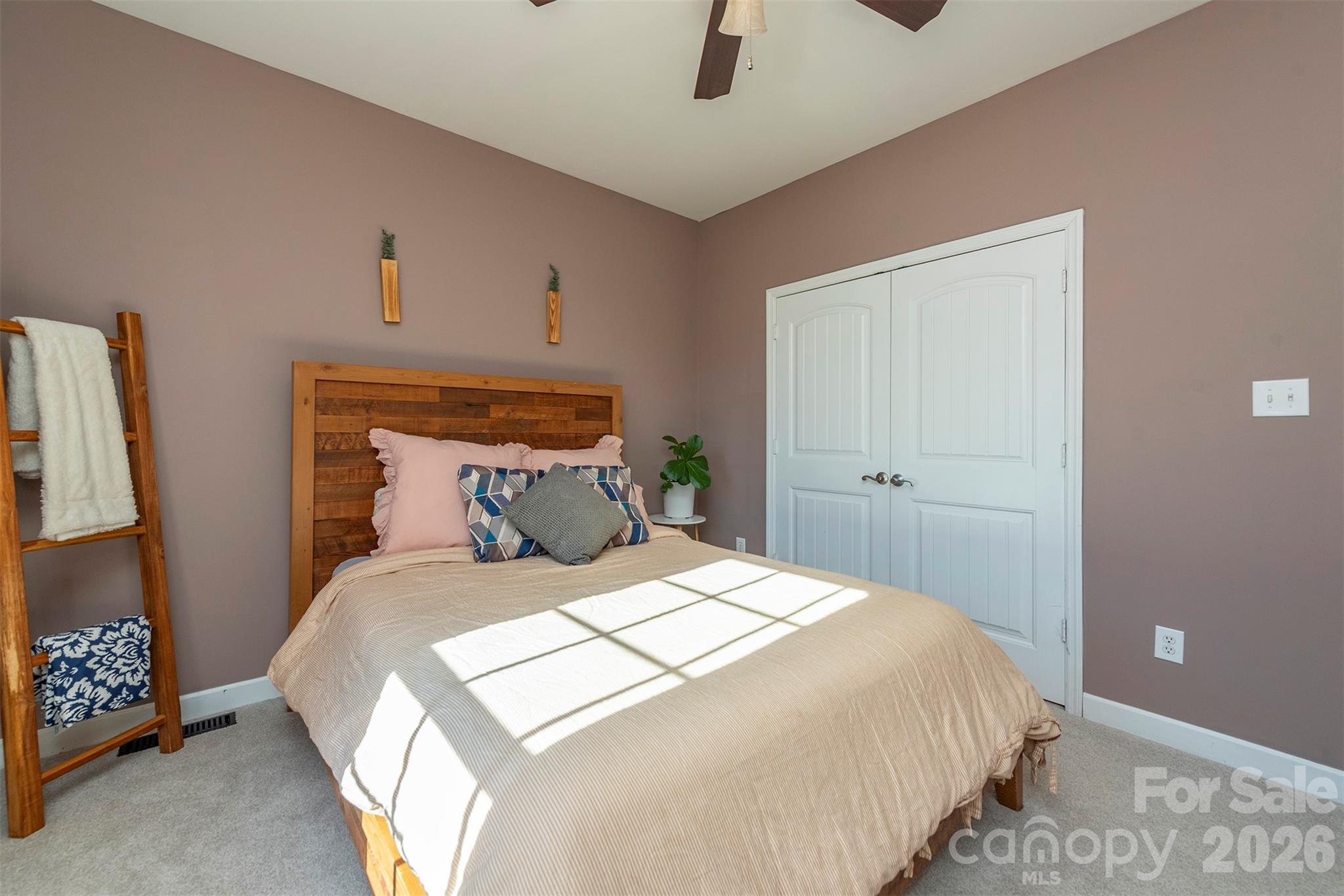 243 Scenic Ridge Drive Hendersonville, NC 28792 - Photo 25 of 47 a bedroom with a bed and a window