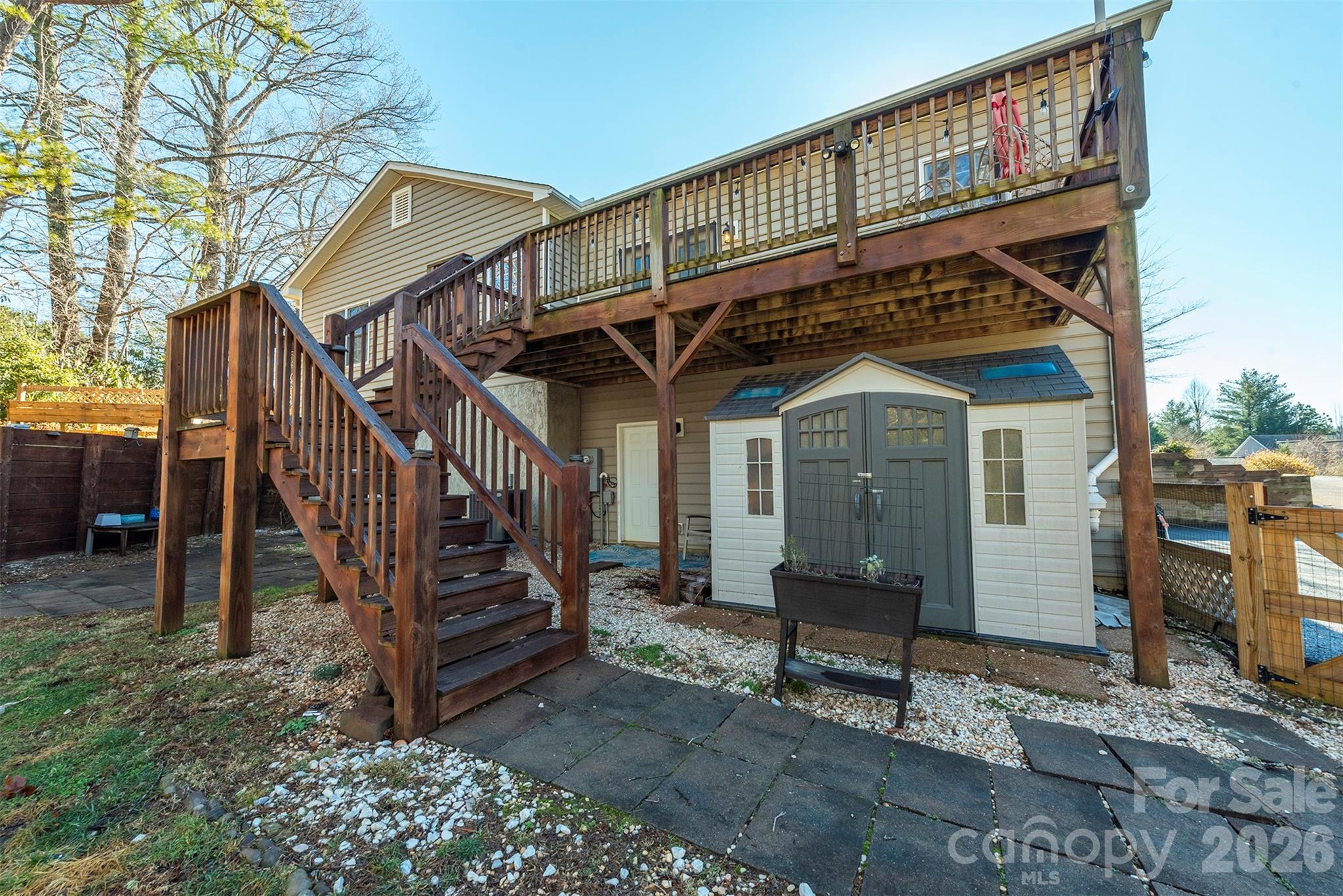 243 Scenic Ridge Drive Hendersonville, NC 28792 - Photo 38 of 47 a view of a house with a wooden deck front of house