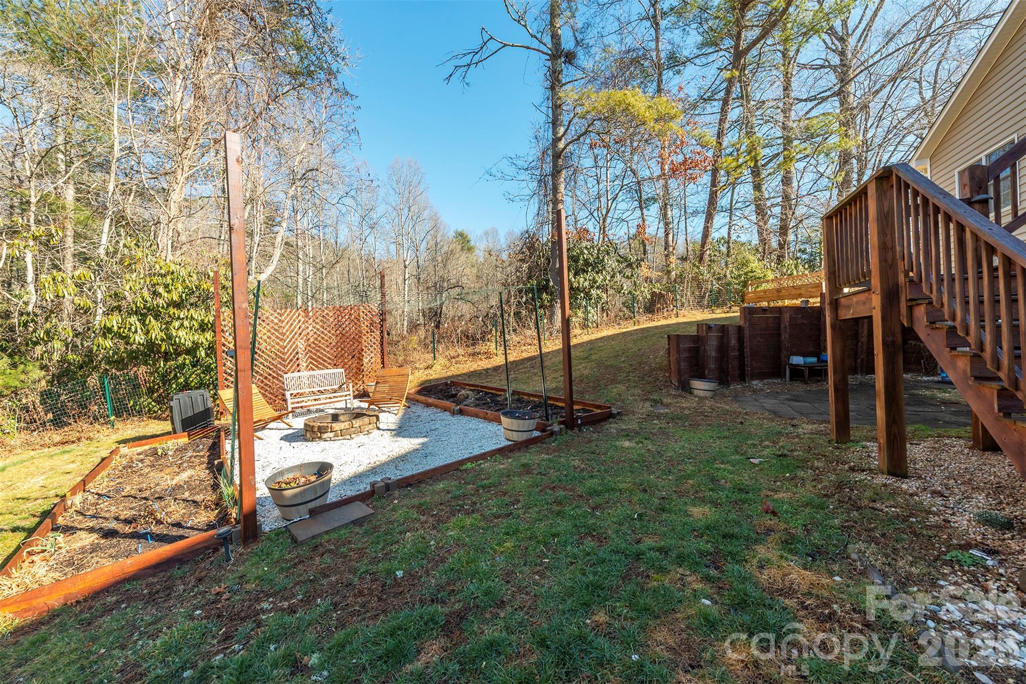 243 Scenic Ridge Drive Hendersonville, NC 28792 - Photo 39 of 47 a view of backyard with wooden fence and trees