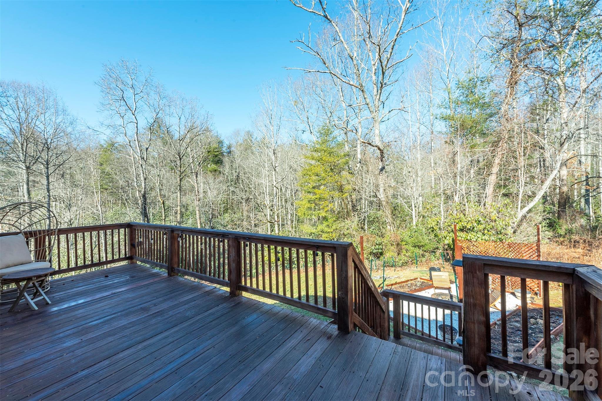 243 Scenic Ridge Drive Hendersonville, NC 28792 - Photo 43 of 47 a view of a roof deck with wooden floor and fence