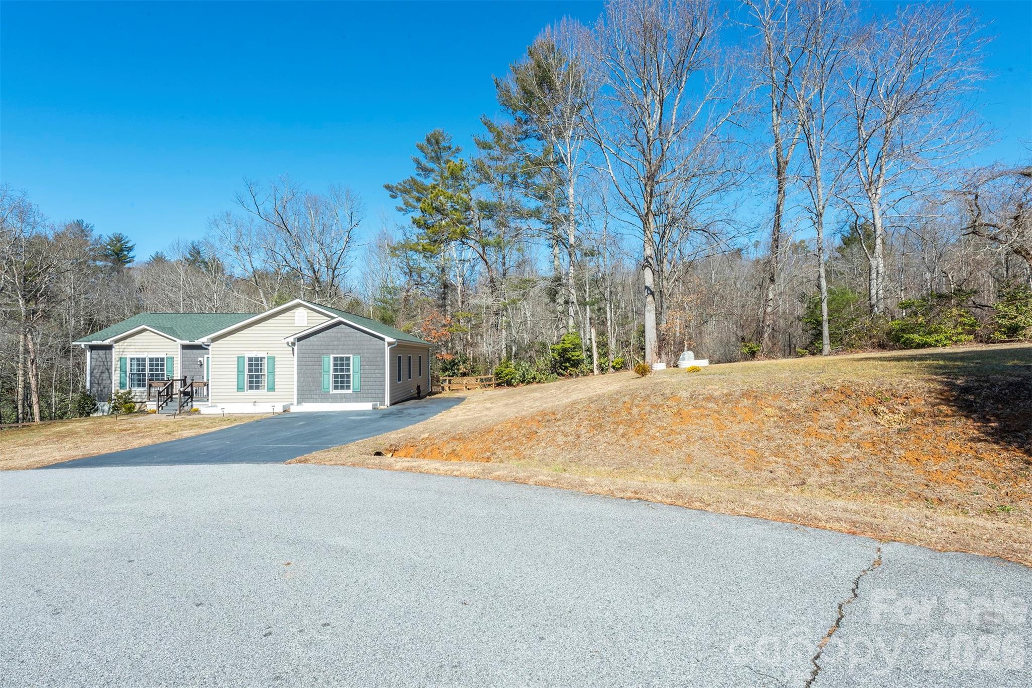243 Scenic Ridge Drive Hendersonville, NC 28792 - Photo 44 of 47 a view of the house with a yard