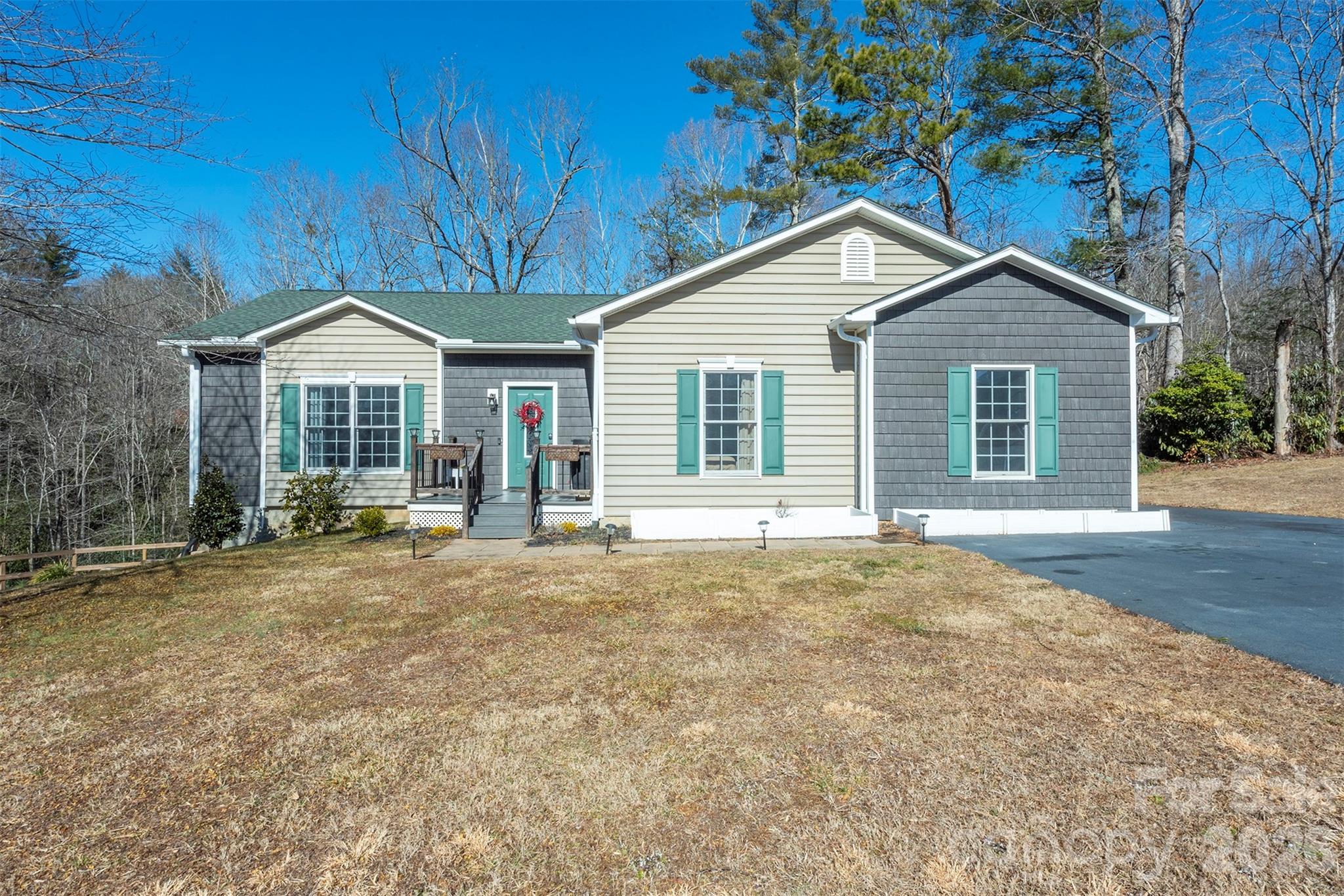 243 Scenic Ridge Drive Hendersonville, NC 28792 - Photo 45 of 47 a house with trees in the background
