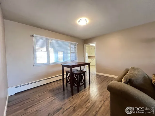 a view of a livingroom with furniture and wooden floor