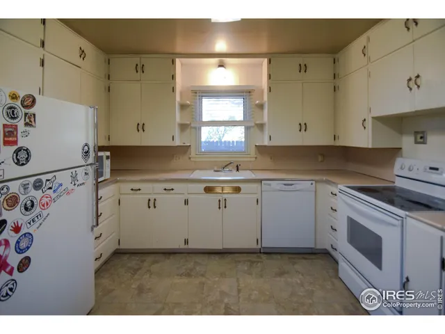 a kitchen with a stove and a sink