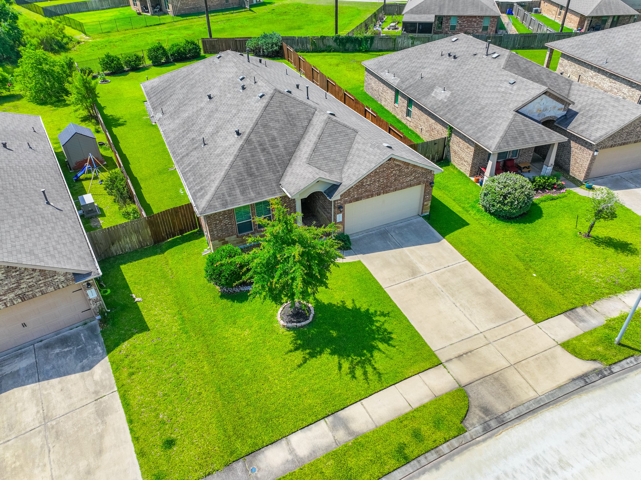 24322 North Newcastle Bay Trail Spring, TX 77389 - Photo 2 of 50 an aerial view of a house with garden space and a street view