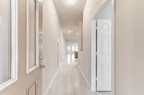 a view of a bedroom from the hallway