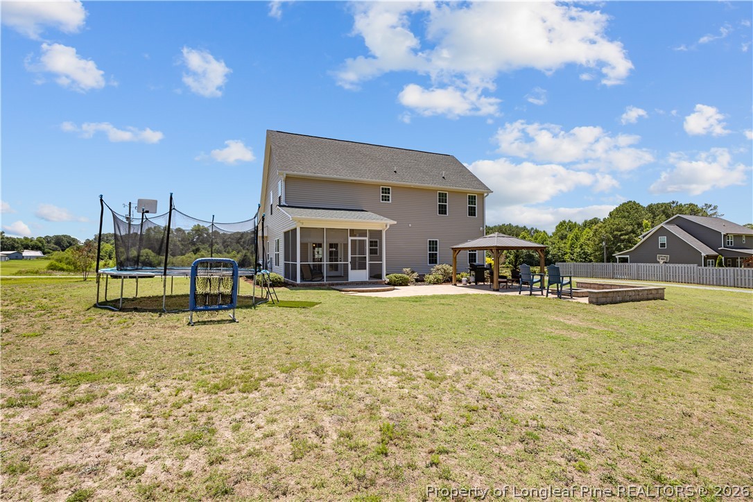 137 Minter School Road Sanford, NC 27332 - Photo 43 of 50 a view of a swimming pool with an outdoor seating and a yard