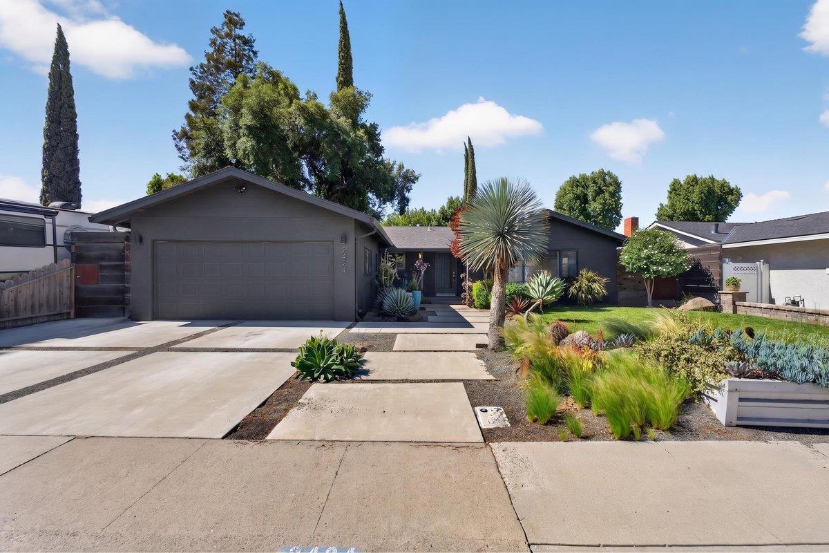 2424 Killarney Way Modesto, CA 95355 - Photo 28 of 30 a front view of a house with a garden